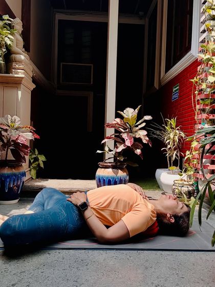 This is Supta Baddha Konasana, or Reclined Butterfly Pose. It is a deeply restorative posture that I recommend for stress relief. It allows your back to melt into the mat and your breath to deepen, signaling to your body that it is time to let go.