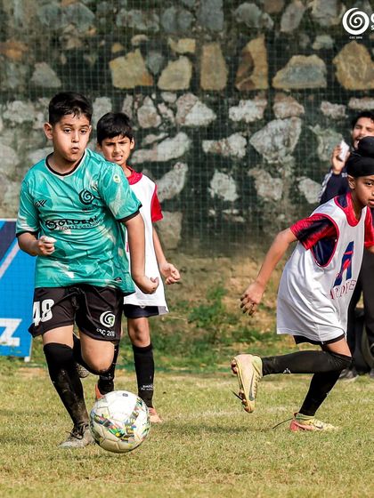 Players from both teams watch intently as the ball is in play during the GSC vs Ardee School game.