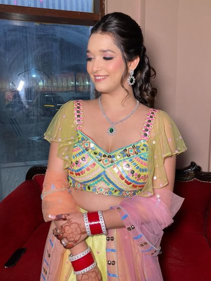 Ritzee looking absolutely lovely and ready for her mehndi. The colorful outfit, diamond jewelry, and fresh makeup all come together beautifully.