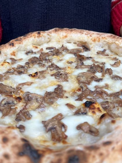 A close-up on our Pizza Bianca with mushrooms. The earthy mushrooms and creamy cheese are a perfect pairing.