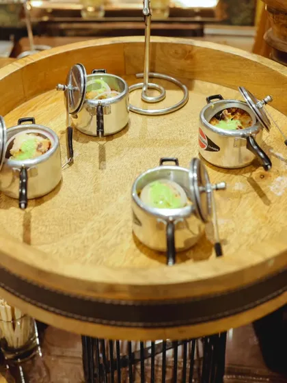 An example of my unique food presentation. Here, a savory dish is served in individual miniature pressure cookers, adding a playful and memorable touch to the dining experience at a corporate inauguration.