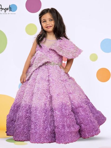 A full view of the purple fur textured gown, a true statement piece for a budding fashionista.