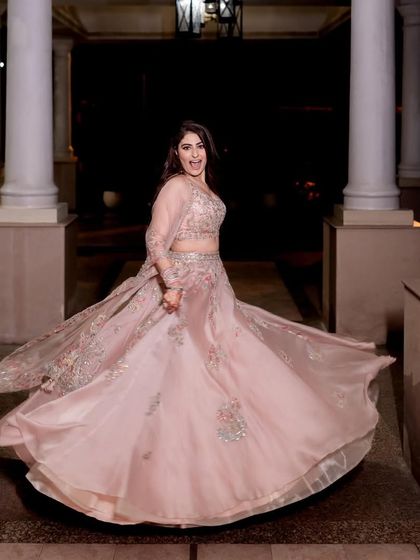 A twirling shot from my own wedding festivities, feeling like a princess in my pastel lehenga.