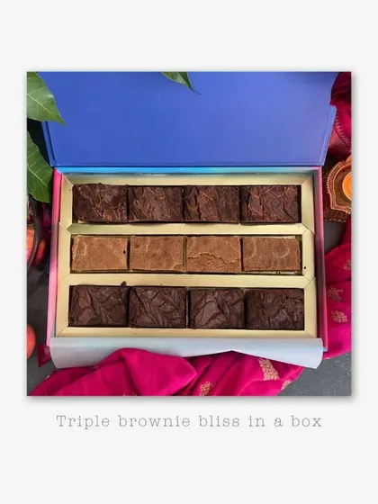 For all the brownie lovers, I present The Brownie Box. This box is pure indulgence, featuring three of my signature flavors: decadent Nutella chocolate brownies, rich Biscoff chocolate brownies, and sweet brown sugar vanilla blondies. Each piece is incredibly fudgy and baked to perfection.