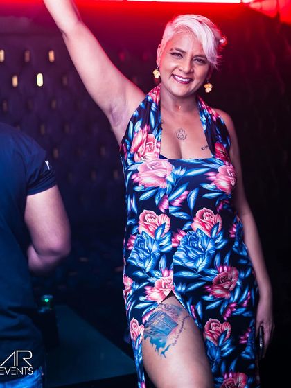 A guest with a unique style, posing for the camera.