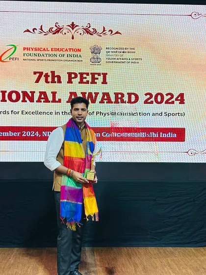 Receiving the 'Best Coach Award' at the 7th PEFI National Awards. It was an honor to be recognized among so many esteemed leaders in Indian sports.