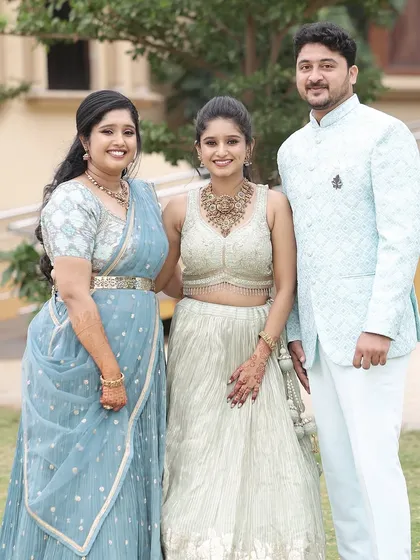 The bride and her sister with the groom. It's always fun to create looks for the whole family.