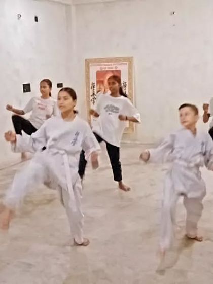 I am observing the students' form closely, ready to correct any mistakes. My job is to guide them.