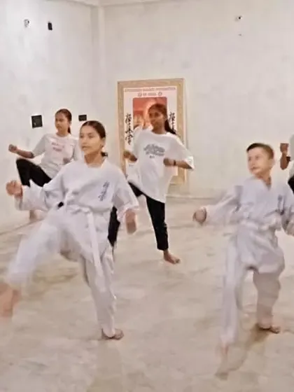 I am observing the students' form closely, ready to correct any mistakes. My job is to guide them.