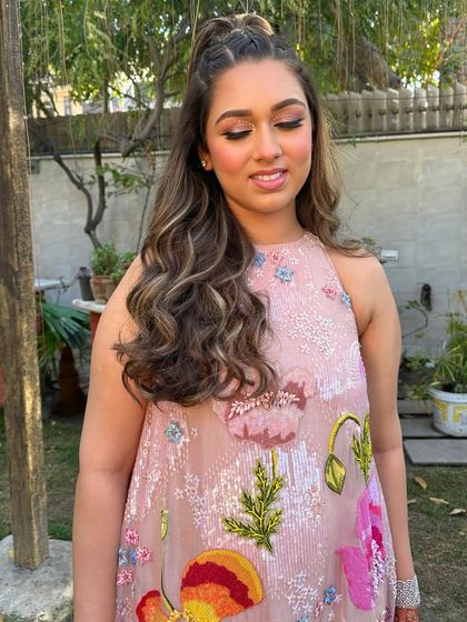 Glistening in pink with a modern flair. This look features a beautiful shimmery eye and a flawless base, perfect for a day party.