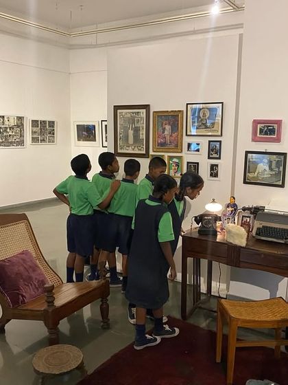 School students from Parikrma exploring the recreated living room and vintage objects in 'Southern Stars'.