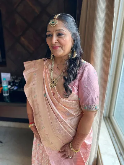 A beautiful portrait showcasing the soft makeup and elegant hairstyle. Beauty truly has no age limit.