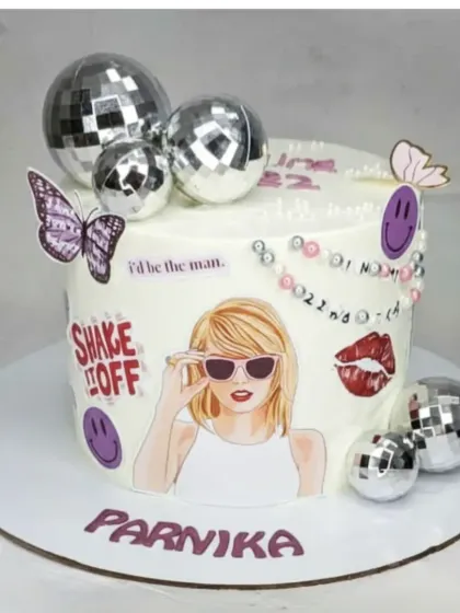 Tapping into pop culture trends is one of my favorite things to do. This Taylor Swift themed cake, with its disco balls and fun graphics, is a chocolate coffee flavor, perfect for celebrating in style.
