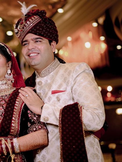 A candid shot of the groom smiling on his wedding day. Capturing these genuine moments of happiness is just as important as the formal portraits.