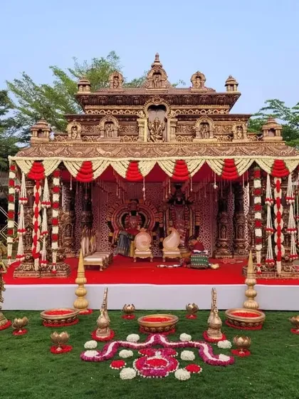 For grand weddings, I can create breathtaking mandaps like this traditional temple-inspired structure. The intricate details, rich colors, and outdoor setting make for a truly royal wedding ceremony.