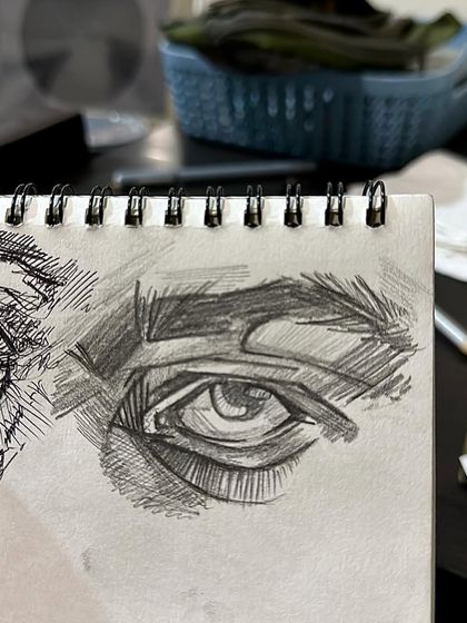 A quick, expressive eye sketch done with a pen in my notebook. Different from my hyper-realistic work.