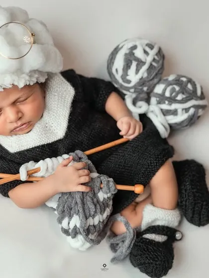 Who says newborns can't have a sense of humor? This playful "grandma" setup, complete with a yarn wig, tiny glasses, and knitting needles, is an example of how I love to get creative and design a truly one-of-a-kind newborn photoshoot.