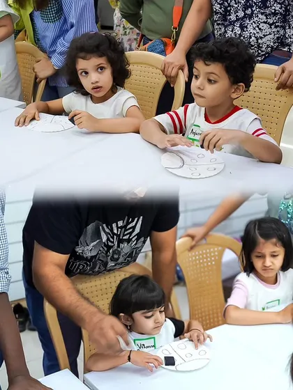 Teamwork makes the dream work! Kids at our Playart Party work on their individual craft projects at a shared table, learning and creating together.