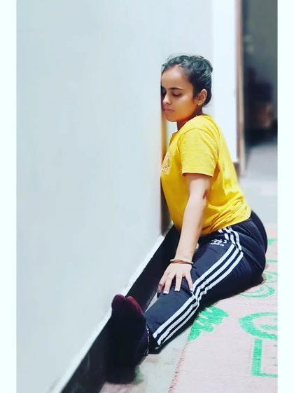 Using a wall for support is a great way to work on your middle split. It allows you to relax into the stretch and hold it for longer, which helps to increase flexibility in the hips and inner thighs.