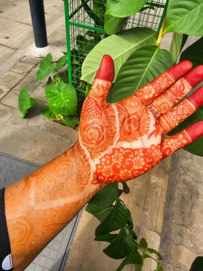 The vibrant orange of a fresh henna stain, a sign of pure, natural henna.