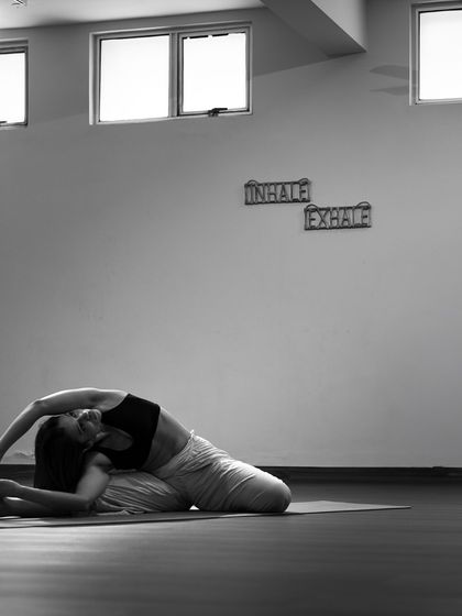 The shala's minimalist aesthetic, with the 'Inhale Exhale' signs serving as a constant reminder of our primary focus: the breath.