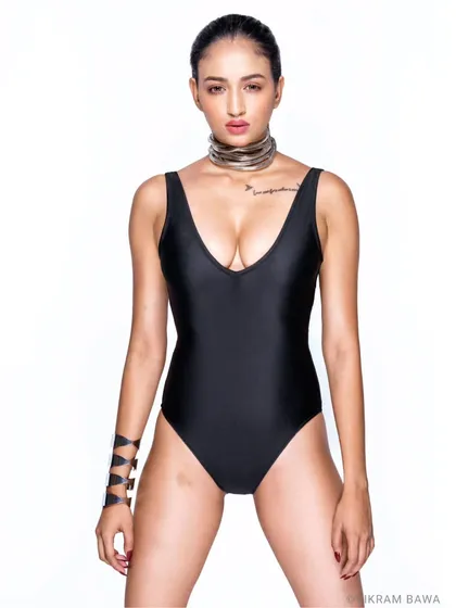 New kid on the block. For her first shoot of this style, Sweta rocked it. A powerful, direct-to-camera pose in a simple black swimsuit against a white backdrop.