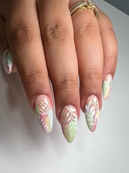 Soft pastel nails perfect for the monsoon season. This design uses a gentle color palette with white floral line art for an eye-catching but subtle look.