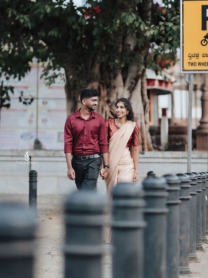 A walking shot in Mysore, with the unique street bollards creating leading lines towards the couple.