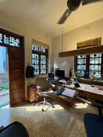 A candid shot of our main studio space, bathed in the warm morning light. This image captures the lived-in, creative atmosphere of our office, which is a constant source of inspiration.