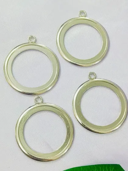 These large, round open-back bezels in a silver finish are perfect for creating statement pendants. The simple design allows your resin art to be the star of the show.