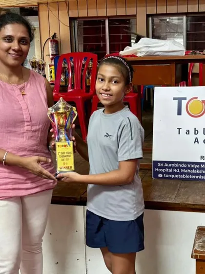 Nine-year-old Anaya holding her first-place trophy after winning the U11 Girls Tournament at Torque Table Tennis. A fantastic achievement for a dedicated player.