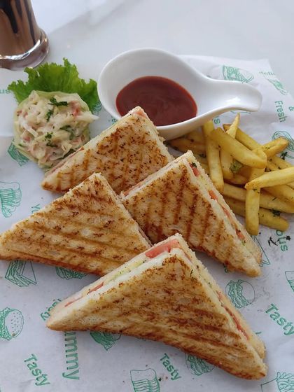 A close-up of our perfectly grilled sandwiches, a comforting and popular choice for any event.