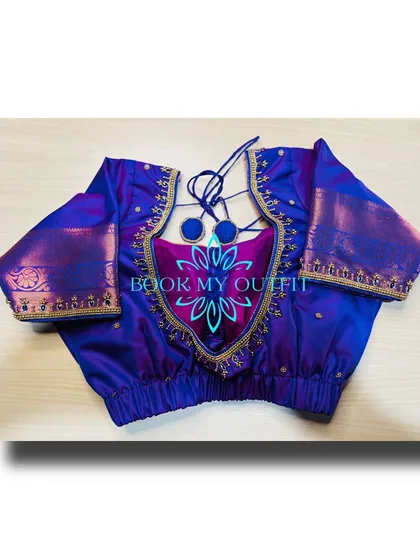 A key part of my service is creating unique blouse designs. This piece features a custom cutout back with delicate tie-ups and intricate zari border work, turning a simple blouse into a statement piece that is tailored for a perfect fit.