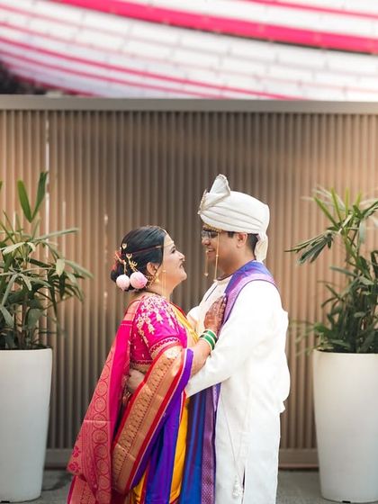A beautiful portrait of a Maharashtrian couple, capturing the love and excitement of their wedding day.