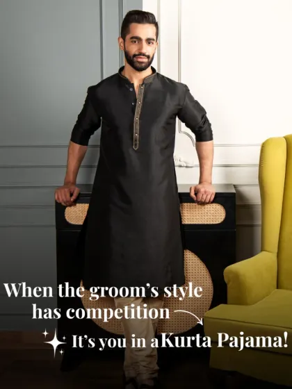 When the groom's style has competition, it's you in a Kurta Pajama. This classic black silk kurta with subtle neckline embroidery is proof that simplicity can be bold.