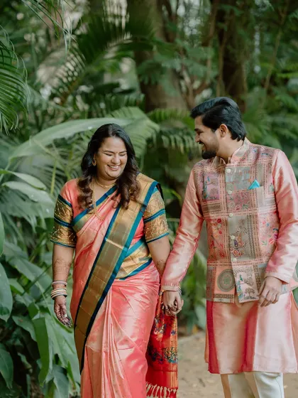 Capturing the couple walking hand-in-hand through a lush garden path. It’s a simple, beautiful moment that speaks volumes about their connection.