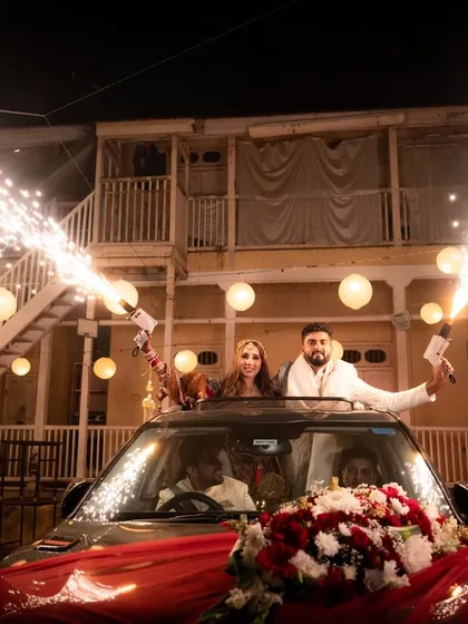 The perfect send-off. This grand exit, complete with sparklers and celebration, captures the energy and excitement of the Vidai. It’s a cinematic end to the wedding day and the start of a new journey together.