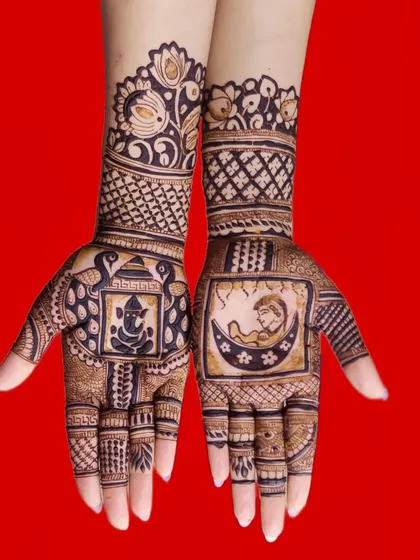 A unique design for a baby shower, featuring a Ganesha motif for blessings on one palm and a baby sleeping on the moon on the other.