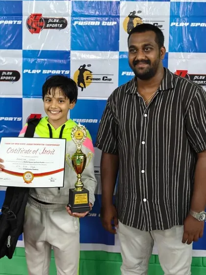 We build champions from the ground up. Here is our U-13 player Anwesha Singh with her winner's trophy from the Fusion Cup Open State Junior Championship. We nurture young talent with the same professional focus as our senior players.