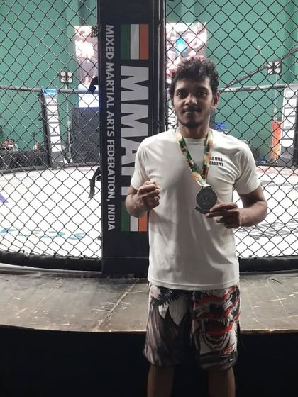 Posing with my Silver medal inside the cage at the BJJ Nationals in Mumbai. Competing in a cage environment is a different kind of pressure.