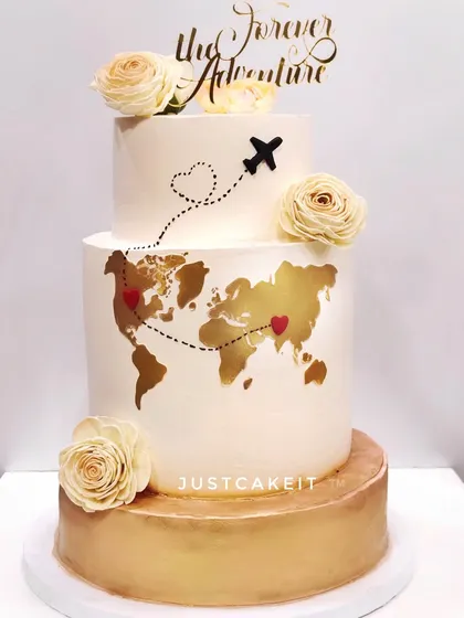 This "Forever Adventure" cake was for a couple's wedding, celebrating their love story that spans across the globe. The edible gold world map is a beautiful, personal touch.