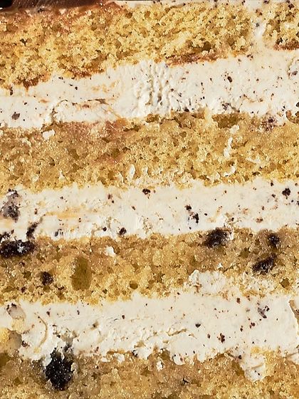 A close-up view of the layers of my Cookie & Cream Cake, showing the texture of the sponge and the creamy, cookie-filled frosting.