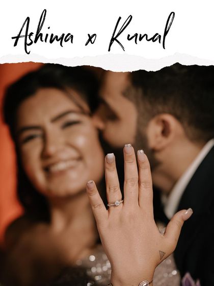 A beautiful close-up of the engagement ring, with the happy, blurred faces of the couple in the background, perfectly announcing their new chapter.