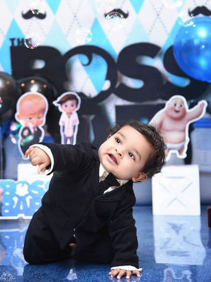 A classic "Boss Baby" pose. This theme is perfect for capturing the humorous and commanding personality of your little one.