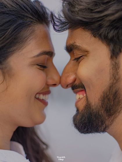 A close-up of pure happiness. This pre-wedding portrait captures the couple nose-to-nose, their smiles reflecting the genuine joy they find in each other.