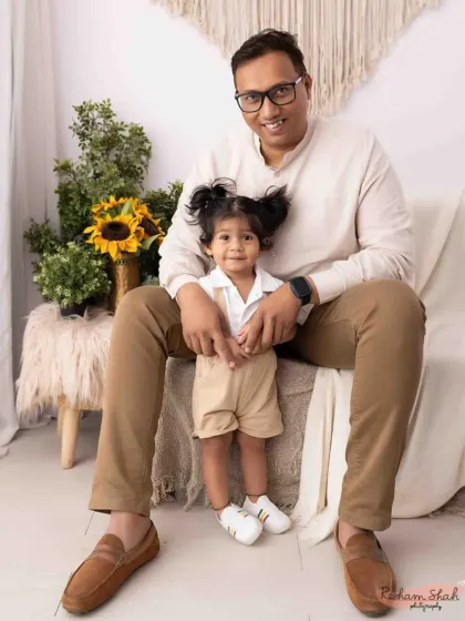 A sweet father-daughter moment in our cozy studio setup. Family portraits are about capturing the feeling of being home.