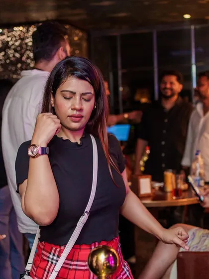 A guest dancing with her eyes closed, completely lost in the groovy beats.