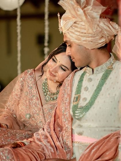 A quiet, tender moment. The makeup is flawless even in close-up, focusing on a natural, dewy finish.