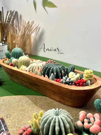 Another angle of the Succulent Obsession candle, showcasing the variety of cactus and succulent shapes and colors that make it a true statement piece.