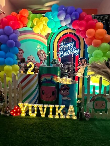 This wide shot shows how the entire Cocomelon setup transforms a corner of the home into a colorful party zone.